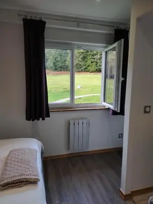 Un ou plusieurs lits dans un hébergement de l'établissement Chambre d'hôtes LES BRIMBELLES