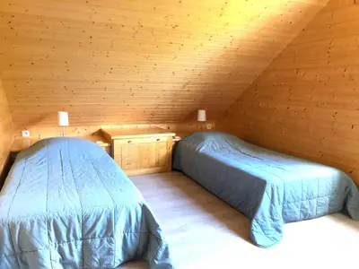 Un ou plusieurs lits dans un hébergement de l'établissement Chalet Myrtille