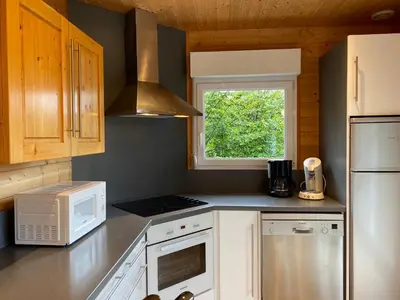 Cuisine ou kitchenette dans l'établissement Chalet Myrtille