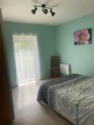 Un ou plusieurs lits dans un hébergement de l'établissement Gîte Auberge du fumoir