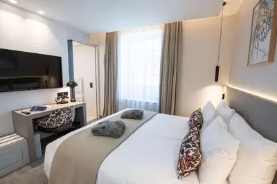 Un ou plusieurs lits dans un hébergement de l'établissement Best Western Premier Le Chapitre Hotel and Spa