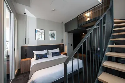 Un ou plusieurs lits dans un hébergement de l'établissement Best Western Premier Le Chapitre Hotel and Spa