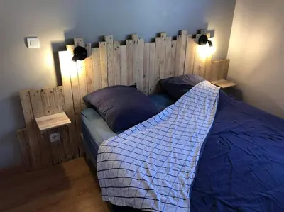 Un ou plusieurs lits dans un hébergement de l'établissement appart. Gérardmer - Le Rep'Air
