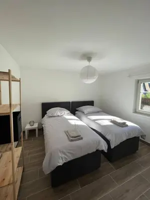 Un ou plusieurs lits dans un hébergement de l'établissement Gite Terrasse Le Doux Refuge à Beblenheim Parking privé