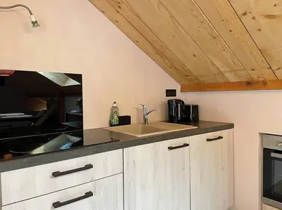Cuisine ou kitchenette dans l'établissement Au Cocon du Haut Pergé