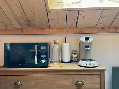 Cuisine ou kitchenette dans l'établissement Au Cocon du Haut Pergé