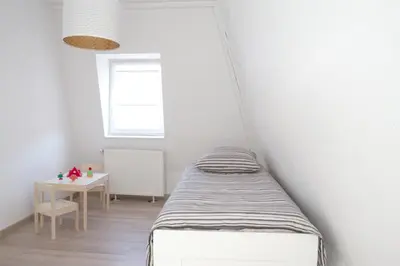 Un ou plusieurs lits dans un hébergement de l'établissement Petite Venise Grand Duplex Turenne Hyper Centre