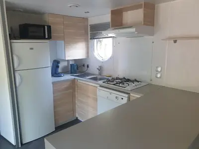 Cuisine ou kitchenette dans l'établissement Camping Pré Vologne