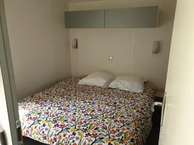 Un ou plusieurs lits dans un hébergement de l'établissement Camping Pré Vologne