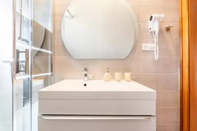 Salle de bains dans l'établissement Les Glycines du Sommerberg