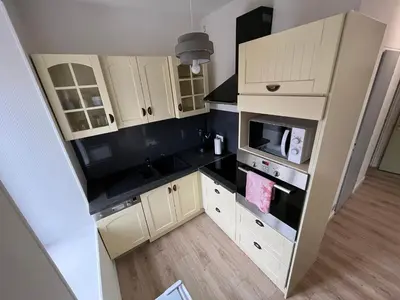 Cuisine ou kitchenette dans l'établissement Appartement centre-ville de Lure gauche