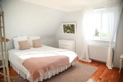 Un ou plusieurs lits dans un hébergement de l'établissement Villa Camélias, appartements de Charme