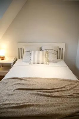 Un ou plusieurs lits dans un hébergement de l'établissement Villa Camélias, appartements de Charme