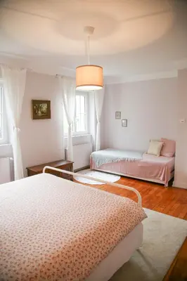 Un ou plusieurs lits dans un hébergement de l'établissement Villa Camélias, appartements de Charme