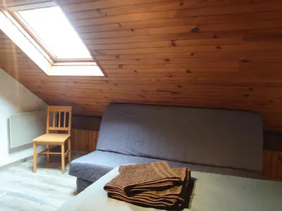 Coin salon dans l'établissement Grand Appartement à Gerardmer
