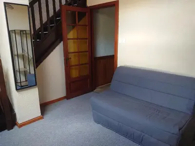 Coin salon dans l'établissement Grand Appartement à Gerardmer