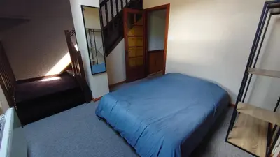 Un ou plusieurs lits dans un hébergement de l'établissement Grand Appartement à Gerardmer