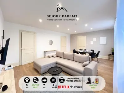 Coin salon dans l'établissement Appart'Hôtel Le Jaurès - Jardin privé et Netflix