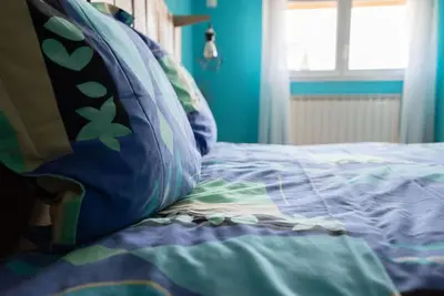 Un ou plusieurs lits dans un hébergement de l'établissement Gîte Les Lavandières