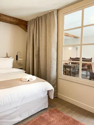 Un ou plusieurs lits dans un hébergement de l'établissement Le Baumann Concept: Appartement de Charme dans un Monument Historique