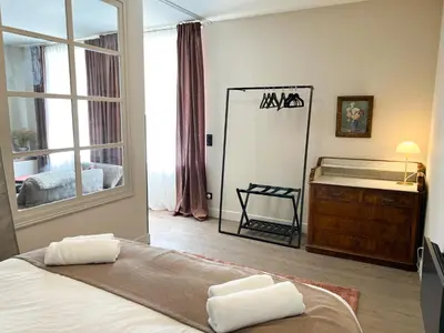 Un ou plusieurs lits dans un hébergement de l'établissement Le Baumann Concept: Appartement de Charme dans un Monument Historique