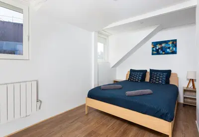 Un ou plusieurs lits dans un hébergement de l'établissement La Maison de maître - centre historique - 3 rue henriette