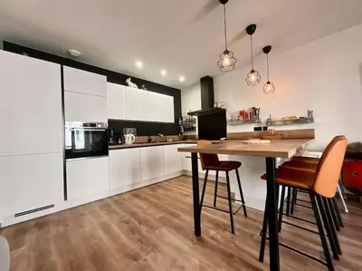 Cuisine ou kitchenette dans l'établissement L’Appart Gabriela, gîte de standing hypercentre