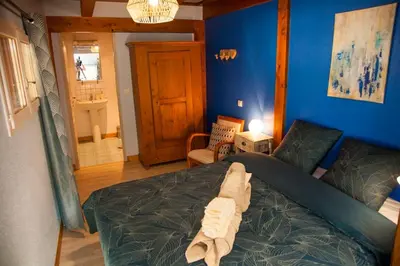 Un ou plusieurs lits dans un hébergement de l'établissement Gîte „La maison des épices“