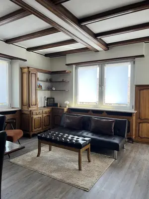 Coin salon dans l'établissement BONNE IDEE - Suite GEORGES - Meublé de tourisme 4 étoiles