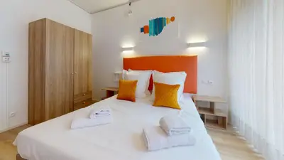 Un ou plusieurs lits dans un hébergement de l'établissement Maison Mandarine Colmar 5 bedrooms 180m2