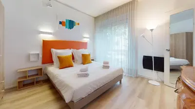 Un ou plusieurs lits dans un hébergement de l'établissement Maison Mandarine Colmar 5 bedrooms 180m2