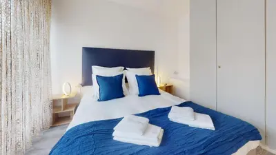 Un ou plusieurs lits dans un hébergement de l'établissement Maison Mandarine Colmar 5 bedrooms 180m2