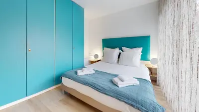 Un ou plusieurs lits dans un hébergement de l'établissement Maison Mandarine Colmar 5 bedrooms 180m2