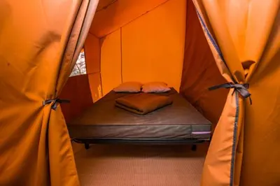 Un ou plusieurs lits dans un hébergement de l'établissement Camping Onlycamp Vauban