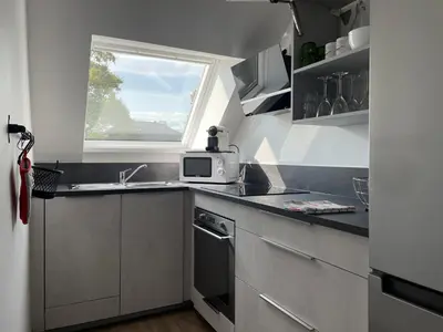 Cuisine ou kitchenette dans l'établissement A l'ombre du figuier