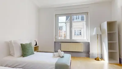 Un ou plusieurs lits dans un hébergement de l'établissement Appartements Rue du Chêne