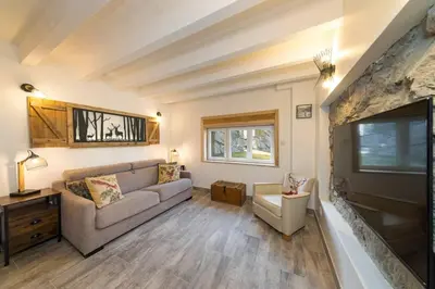 Coin salon dans l'établissement Home des bois