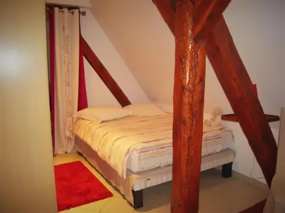 Un ou plusieurs lits dans un hébergement de l'établissement Bel appartement de charme de 70 m2