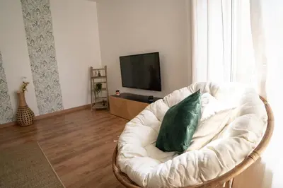 Télévision ou salle de divertissement dans l'établissement Le Luma
