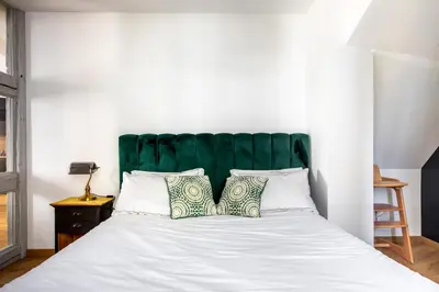 Un ou plusieurs lits dans un hébergement de l'établissement Appartement de l'Arsenal
