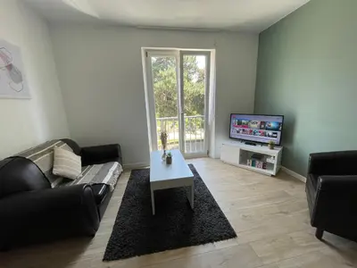 Télévision ou salle de divertissement dans l'établissement NEW appartement proche gare et centre-ville