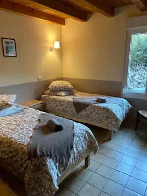 Un ou plusieurs lits dans un hébergement de l'établissement Domaine des oiseaux