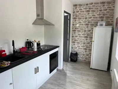 Cuisine ou kitchenette dans l'établissement Nid douillet à La Bresse