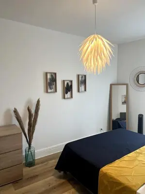Un ou plusieurs lits dans un hébergement de l'établissement appartement cosy et lumineux avec parking gratuit