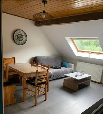 Coin salon dans l'établissement Appartement 6/8 pers Le Petit Bertin