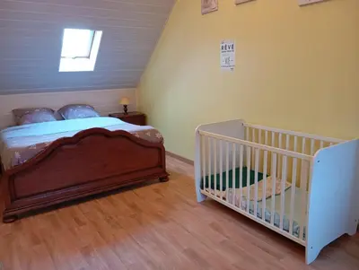 Un ou plusieurs lits dans un hébergement de l'établissement Maison de ville avec jardin-Rêve à Rixheim!