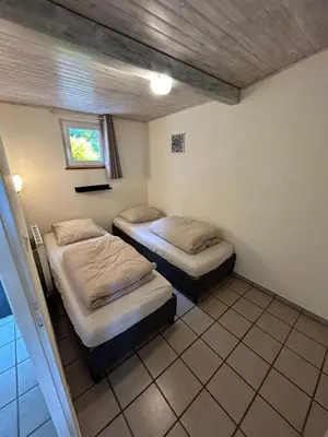 Un ou plusieurs lits dans un hébergement de l'établissement Camping du Château