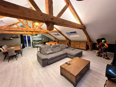Coin salon dans l'établissement loft 100m2 confort+. Chez Cédric et Jeza