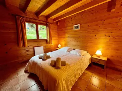 Un ou plusieurs lits dans un hébergement de l'établissement Chalet Verlaine 4* magnifique et authentique