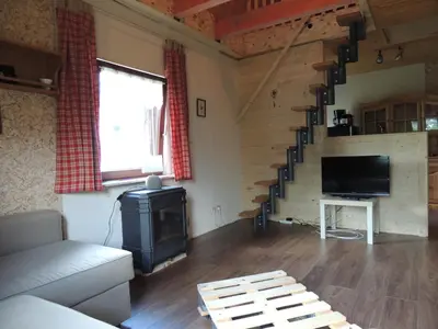 Télévision ou salle de divertissement dans l'établissement Les Hauts de Brochot